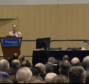 Dr. Flischel speaking at AAD